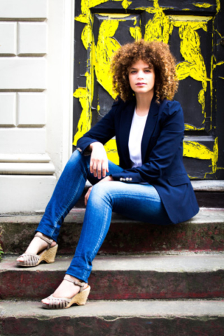 Lisa Armstrong, Model, Principal Director, Innovation consultant and global speaker, Sitting on steps, checked yellow door, Shoreditch, London, photographer BronacMcNeill